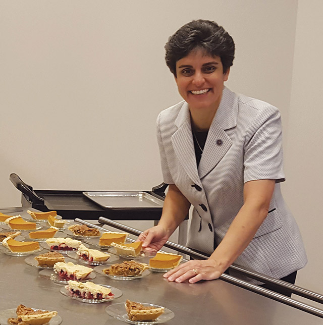 Sister Tonette Sperando, O.S.B. helps serve pie.