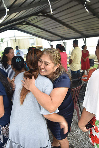 María Dolores Cerino García, has a big smile today at the Sign of Peace