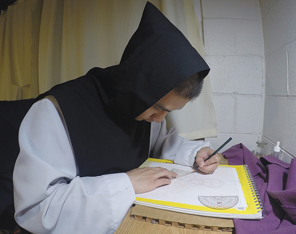 Father Guerric Llanes, O.C.S.O.’ works on an icon at the Abbey of Our Lady of New Clairvaux