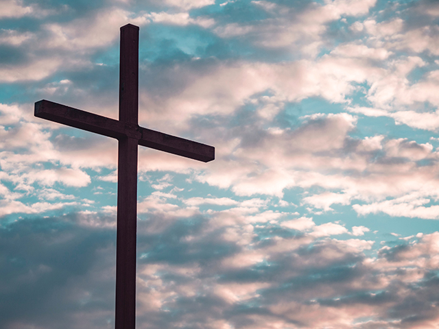 cross against a beautiful sky