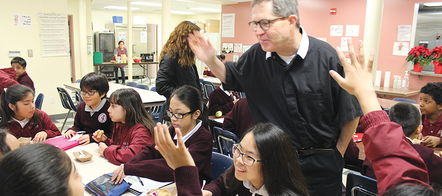 Brother Joseph Kirk, F.S.C. in the classroom with students